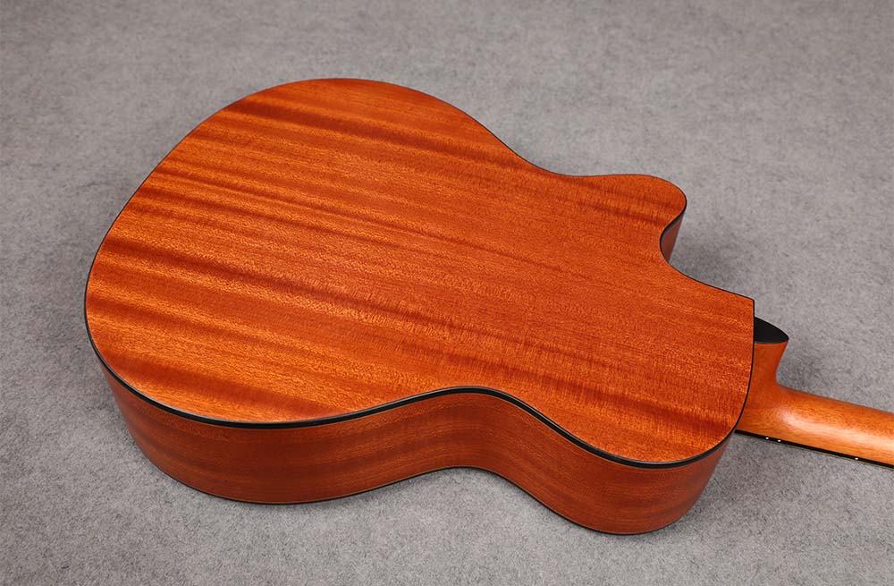 Back of the SQOE F4030 Natural acoustic guitar showing Sapele wood grain