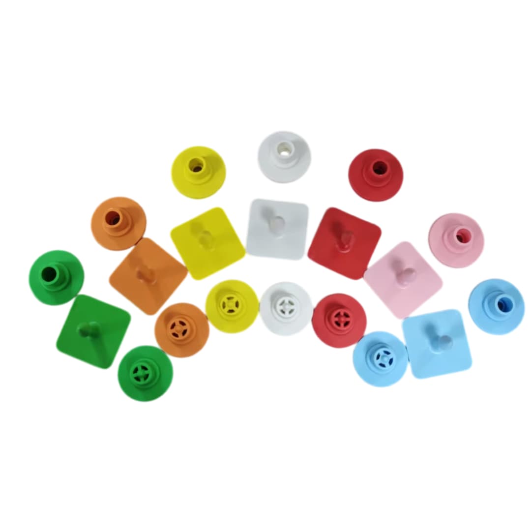 Close-upofcolorfulroundbackingcapswithcross-lockdesignforTPUeartags