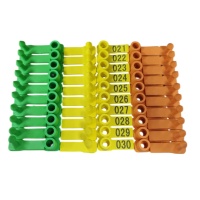 Multi-colornumberedlivestockeartagsyellowgreenorangewithsequentialnumbers