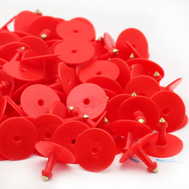 PileofredTPUeartagcopperpinswithsharpbrasstipsforlivestocktagging
